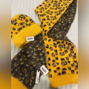 Coco and Carmen winter scarf and ponytail hat. New with tags.